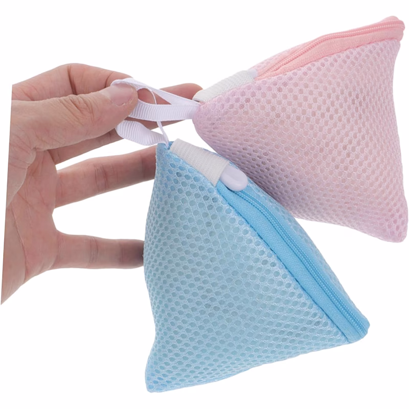 Polyester mesh laundry bag with bras and undergarments, protecting sensitive clothes.