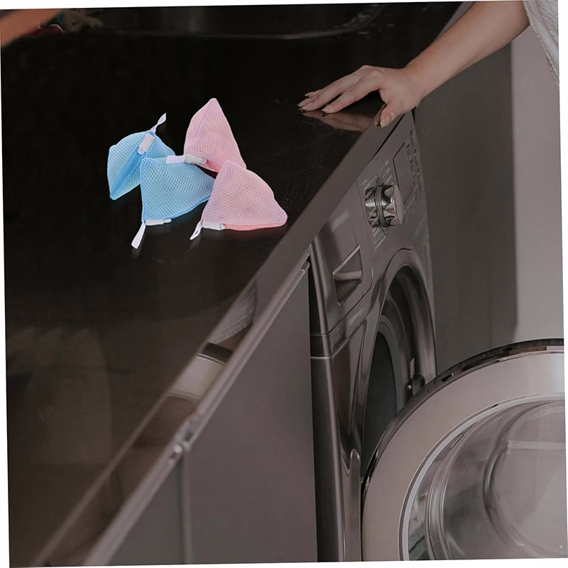Polyester mesh laundry bag with bras and undergarments, protecting sensitive clothes.