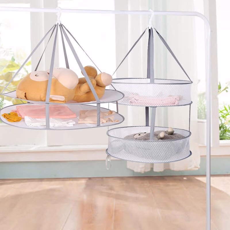 pillow drying net next to three layers folding drying net loaded with cushions and plush toys pillow drying net next to three layers folding drying net loaded with cushions and plush toys